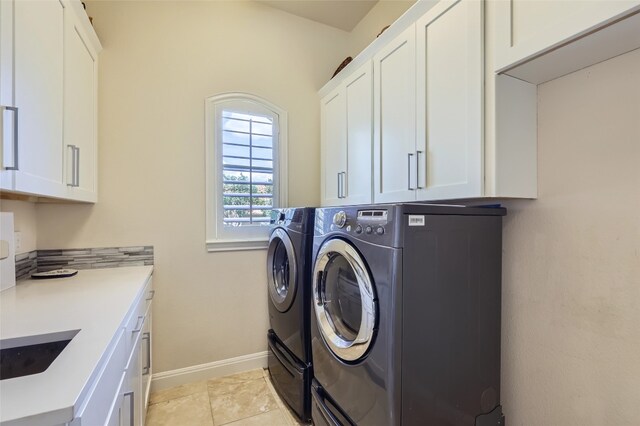 29 Tiburon Dr, The Hills, TX 78738 - laundry area featuring cabinet space, washing machine and clothes dryer, and baseboards