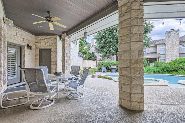 29 Tiburon Dr, The Hills, TX 78738 - view of patio / terrace featuring a ceiling fan, outdoor dining space, and a pool with connected hot tub