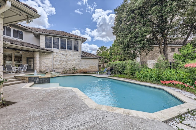 29 Tiburon Dr, The Hills, TX 78738 - view of swimming pool featuring a patio and a pool with connected hot tub