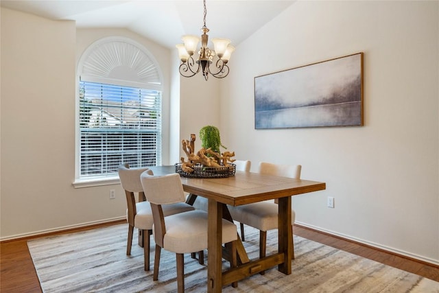 10500 Hendon St, Austin, TX 78748 - dining room with a chandelier, wood finished floors, vaulted ceiling, and baseboards