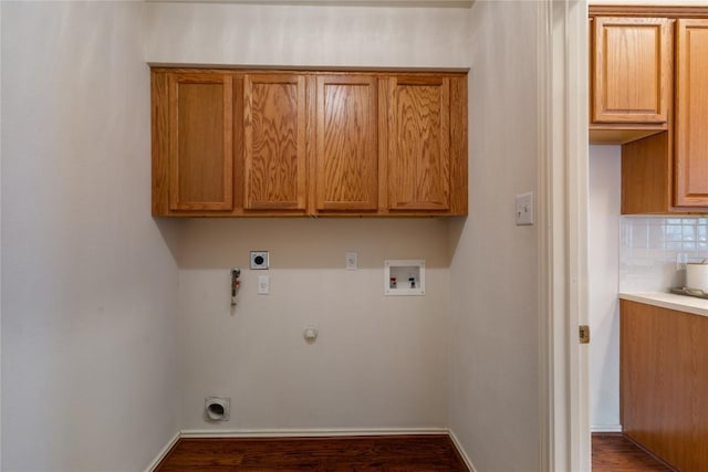 10500 Hendon St, Austin, TX 78748 - laundry room featuring electric dryer hookup, gas dryer hookup, hookup for a washing machine, cabinet space, and wood finished floors