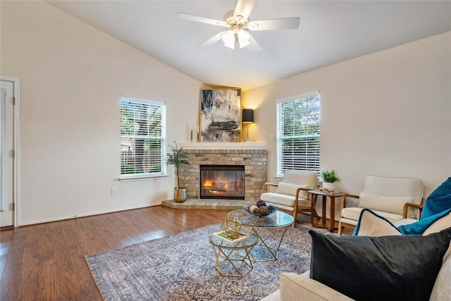 10500 Hendon St, Austin, TX 78748 - living area with vaulted ceiling, wood finished floors, a brick fireplace, ceiling fan, and baseboards