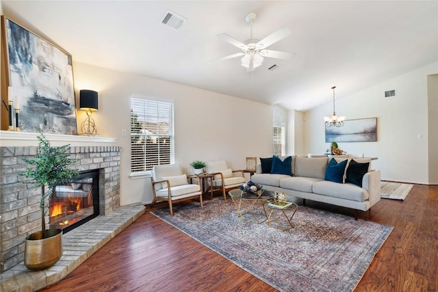 10500 Hendon St, Austin, TX 78748 - living area with plenty of natural light, vaulted ceiling, a brick fireplace, a ceiling fan, and wood finished floors