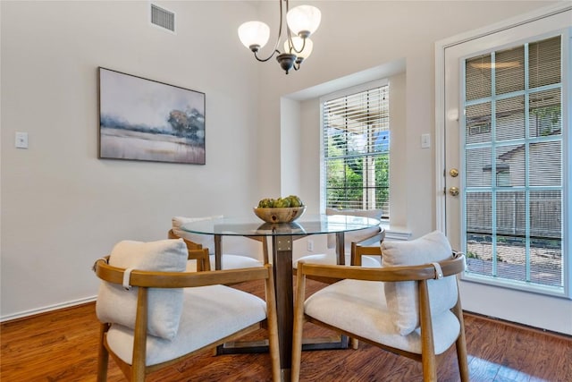 10500 Hendon St, Austin, TX 78748 - dining room featuring a chandelier and wood finished floors