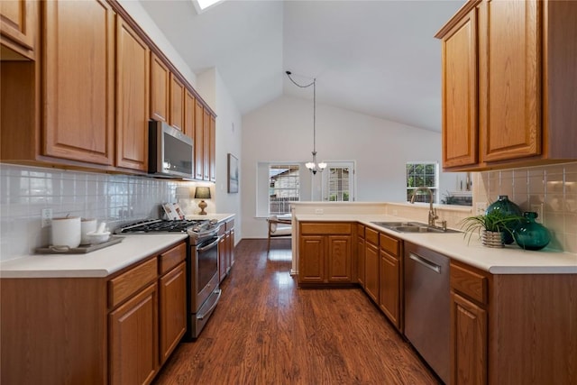 10500 Hendon St, Austin, TX 78748 - kitchen featuring stainless steel appliances, a sink, a peninsula, backsplash, and high vaulted ceiling