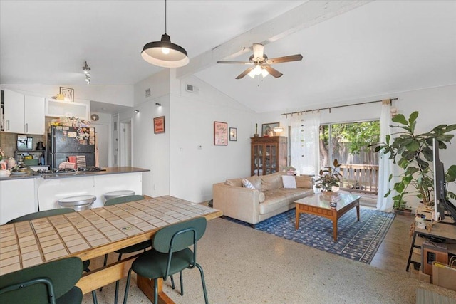 8900 Tina Ct, Austin, TX 78758 - living area with speckle patterned floor and a ceiling fan
