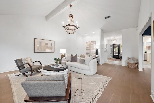 3404 Riva Ridge Rd, Austin, TX 78746 - living area featuring a chandelier, beam ceiling, wood finished floors, and high vaulted ceiling