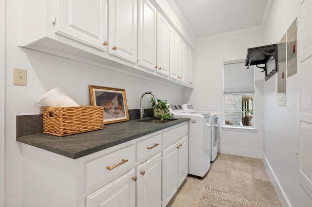 3404 Riva Ridge Rd, Austin, TX 78746 - washroom with washing machine and clothes dryer, ornamental molding, cabinet space, and baseboards