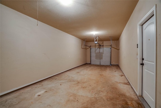 113-119 Creekside Villa Dr, Kyle, TX 78640 - garage featuring a garage door opener and baseboards