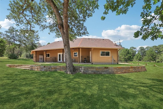 129 Country Air Dr, Bastrop, TX 78602 - back of property featuring a yard and a patio