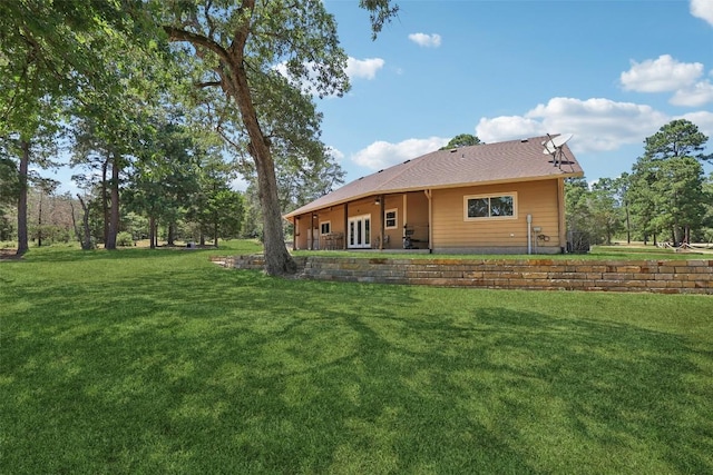 129 Country Air Dr, Bastrop, TX 78602 - rear view of house featuring a yard and french doors