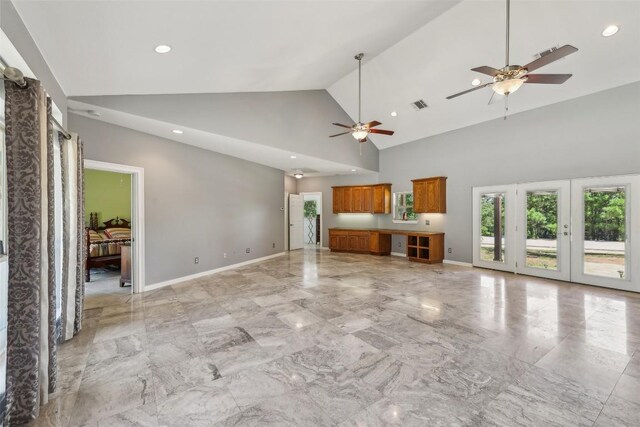 129 Country Air Dr, Bastrop, TX 78602 - unfurnished living room featuring a ceiling fan, recessed lighting, light marble finish flooring, and high vaulted ceiling