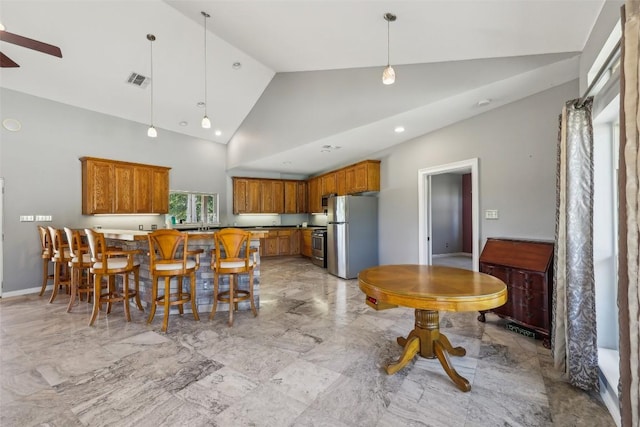 129 Country Air Dr, Bastrop, TX 78602 - dining area featuring light marble finish floors, ceiling fan, recessed lighting, and high vaulted ceiling