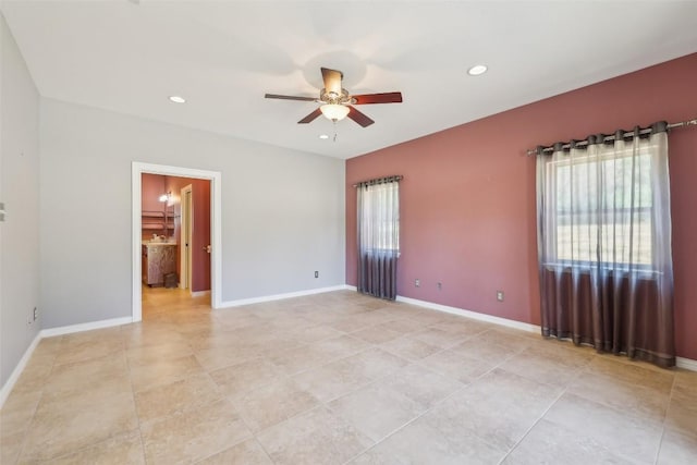 129 Country Air Dr, Bastrop, TX 78602 - spare room with a ceiling fan, light tile patterned floors, and recessed lighting