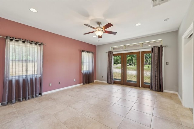 129 Country Air Dr, Bastrop, TX 78602 - empty room with plenty of natural light, a ceiling fan, french doors, light tile patterned floors, and recessed lighting