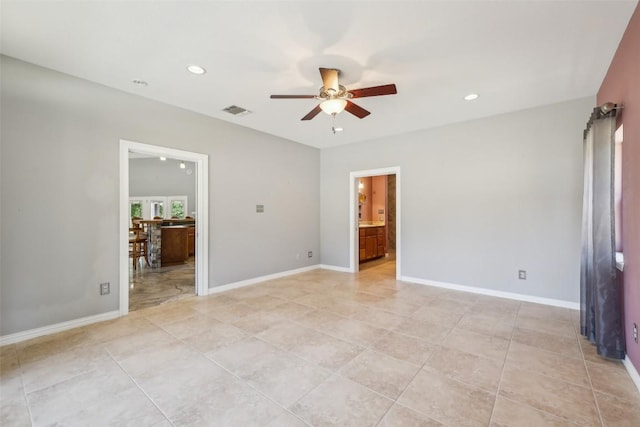 129 Country Air Dr, Bastrop, TX 78602 - unfurnished bedroom featuring recessed lighting, ensuite bath, light tile patterned floors, and a ceiling fan