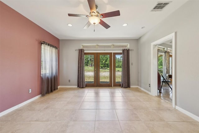129 Country Air Dr, Bastrop, TX 78602 - spare room with french doors, a ceiling fan, light tile patterned floors, and recessed lighting