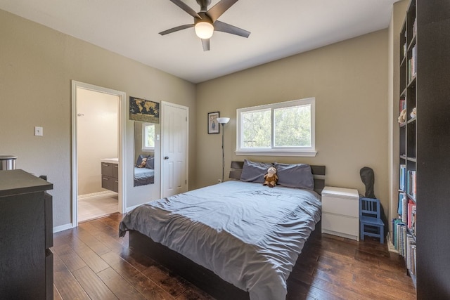 8132 Amelia Cv, Austin, TX 78750 - bedroom featuring dark wood-style floors, connected bathroom, and a ceiling fan