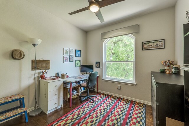 8132 Amelia Cv, Austin, TX 78750 - home office with a ceiling fan and dark wood finished floors