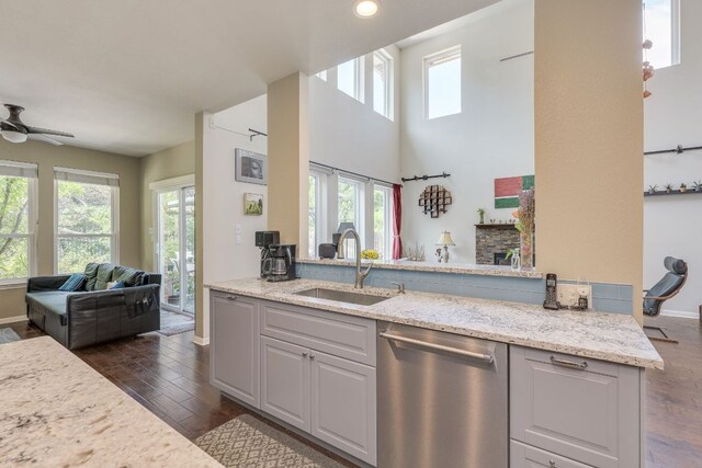 8132 Amelia Cv, Austin, TX 78750 - kitchen featuring dishwasher, healthy amount of natural light, and dark wood-type flooring