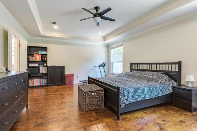 8132 Amelia Cv, Austin, TX 78750 - bedroom with a tray ceiling, hardwood / wood-style floors, crown molding, and a ceiling fan