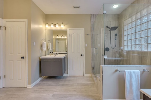 8132 Amelia Cv, Austin, TX 78750 - full bath with vanity, a shower stall, and tile patterned flooring