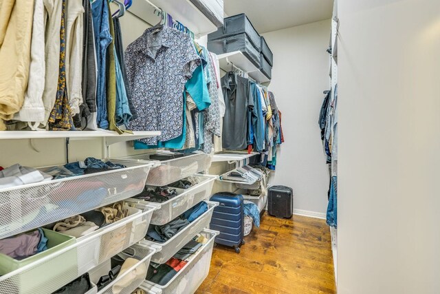 8132 Amelia Cv, Austin, TX 78750 - walk in closet with wood finished floors