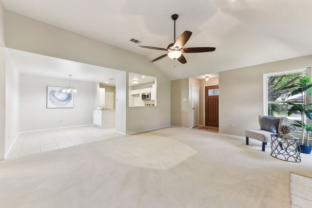 707 Clearwater Trl, Round Rock, TX 78664 - living room with light colored carpet, vaulted ceiling, a ceiling fan, a chandelier, and light tile patterned flooring