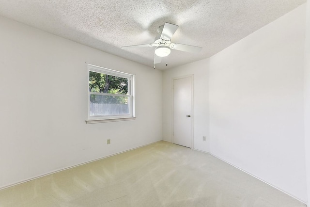 707 Clearwater Trl, Round Rock, TX 78664 - spare room featuring light colored carpet, ceiling fan, and a textured ceiling