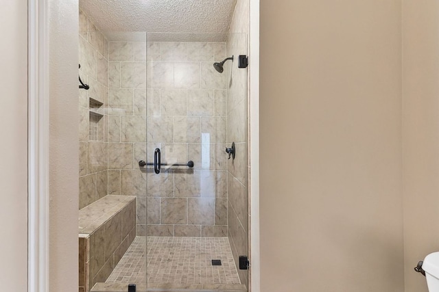 707 Clearwater Trl, Round Rock, TX 78664 - bathroom with a stall shower and a textured ceiling