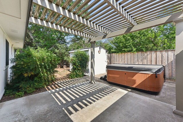 707 Clearwater Trl, Round Rock, TX 78664 - fenced backyard featuring a hot tub, a patio, a storage unit, and a pergola