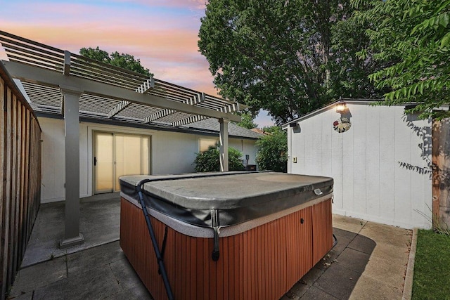 707 Clearwater Trl, Round Rock, TX 78664 - patio terrace at dusk with a hot tub, a pergola, and a patio area