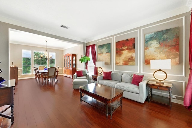 10220 N Chestnut Ridge Rd, Austin, TX 78726 - living area with dark wood-style flooring, a chandelier, crown molding, and baseboards