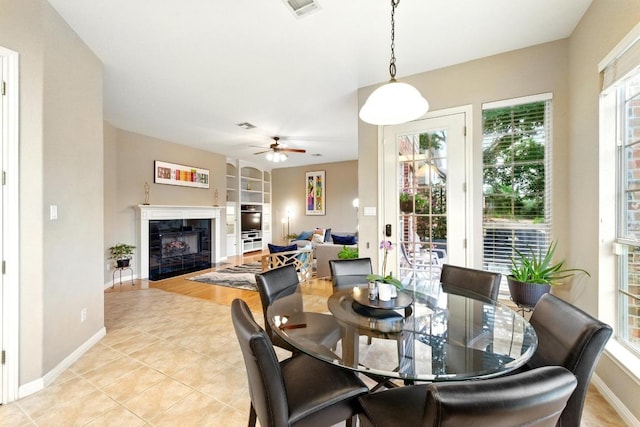 10220 N Chestnut Ridge Rd, Austin, TX 78726 - dining area with built in shelves, healthy amount of natural light, and baseboards