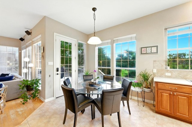 10220 N Chestnut Ridge Rd, Austin, TX 78726 - dining room featuring baseboards and light tile patterned flooring