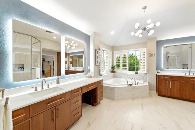 10220 N Chestnut Ridge Rd, Austin, TX 78726 - full bathroom featuring vaulted ceiling, a garden tub, vanity, marble finish flooring, and a chandelier