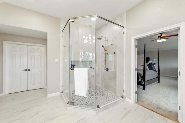 10220 N Chestnut Ridge Rd, Austin, TX 78726 - ensuite bathroom featuring a ceiling fan, marble look tiles, baseboards, and a marble finish shower