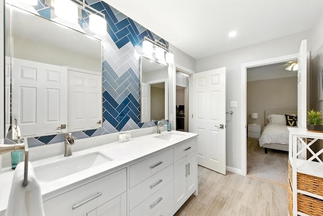10220 N Chestnut Ridge Rd, Austin, TX 78726 - ensuite bathroom featuring double vanity and wood finished floors