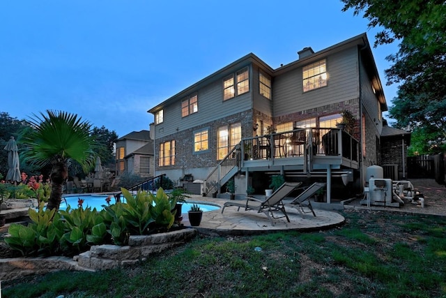 10220 N Chestnut Ridge Rd, Austin, TX 78726 - rear view of property featuring stairs, a patio area, and a wooden deck