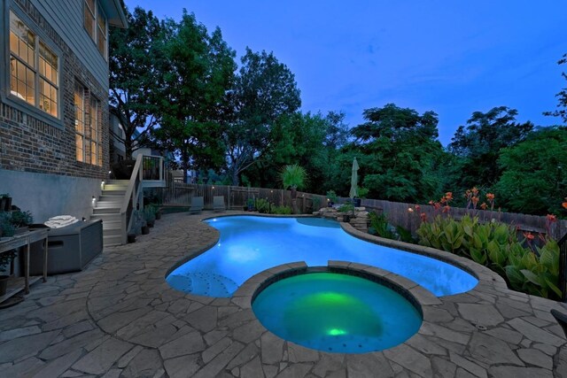10220 N Chestnut Ridge Rd, Austin, TX 78726 - view of swimming pool with a patio area, a pool with connected hot tub, a fenced backyard, and stairs