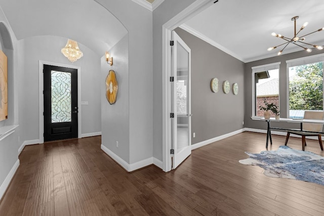 8316 Evelina Trl, Austin, TX 78737 - entryway with a chandelier, arched walkways, dark wood-type flooring, baseboards, and ornamental molding