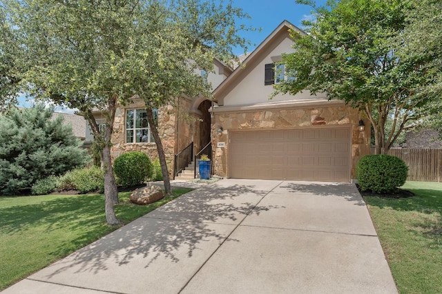 8316 Evelina Trl, Austin, TX 78737 - view of front facade featuring stone siding, driveway, stucco siding, and an attached garage