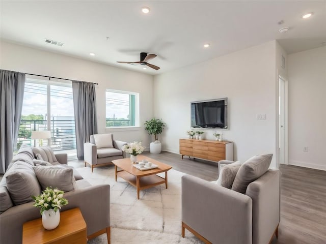 4802 S Congress Ave Unit 310, Austin, TX 78745 - living room featuring a ceiling fan, wood finished floors, and recessed lighting