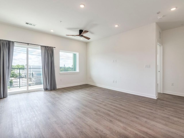 4802 S Congress Ave Unit 310, Austin, TX 78745 - unfurnished room with a ceiling fan, wood finished floors, recessed lighting, and a smoke detector