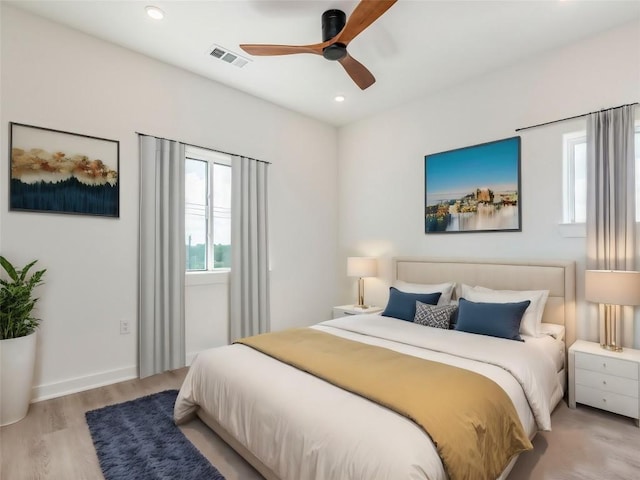4802 S Congress Ave Unit 310, Austin, TX 78745 - bedroom featuring wood finished floors, recessed lighting, and a ceiling fan