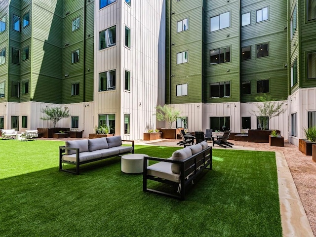 4802 S Congress Ave Unit 310, Austin, TX 78745 - view of home's community featuring an outdoor living space and a yard