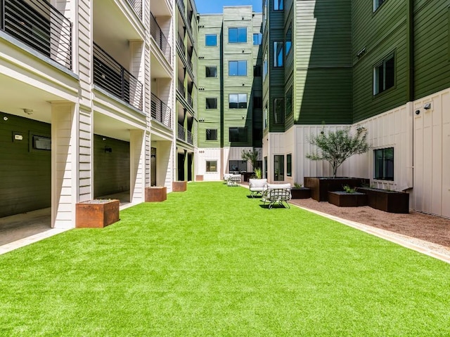 4802 S Congress Ave Unit 310, Austin, TX 78745 - view of property's community featuring a yard