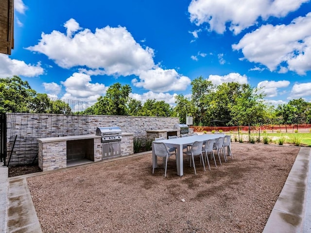 4802 S Congress Ave Unit 310, Austin, TX 78745 - view of patio featuring an outdoor kitchen and outdoor dining space