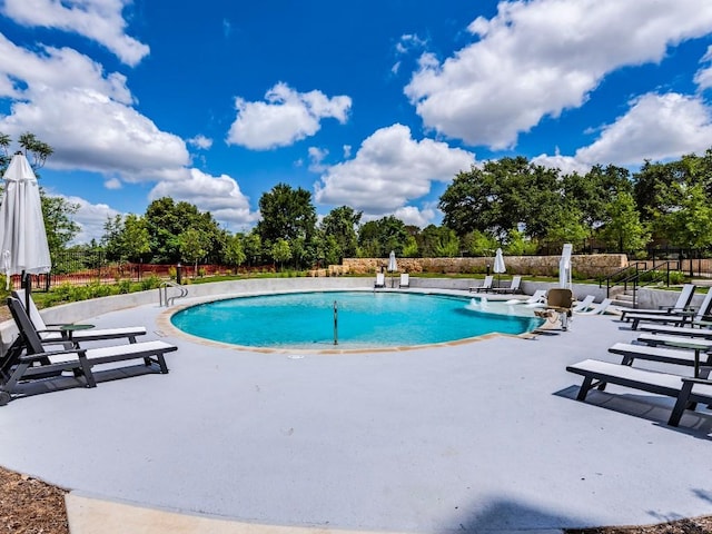 4802 S Congress Ave Unit 310, Austin, TX 78745 - view of swimming pool with a patio and view of scattered trees