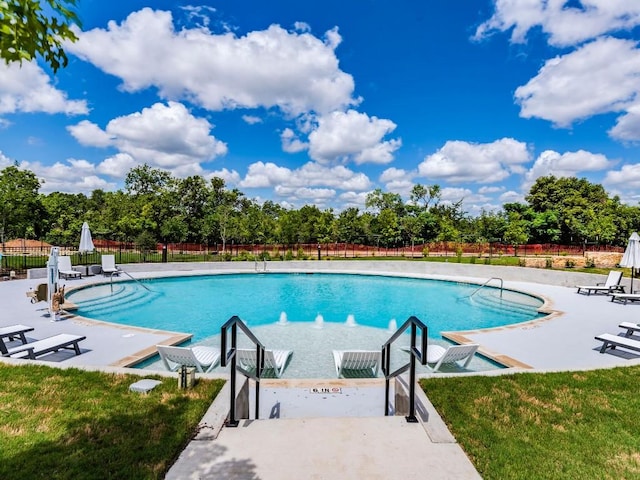 4802 S Congress Ave Unit 310, Austin, TX 78745 - community pool featuring a patio and view of scattered trees